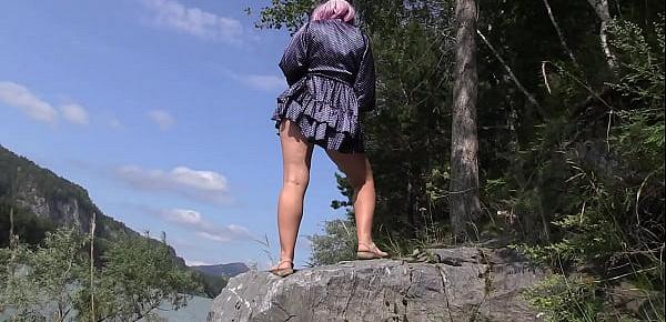  Under the skirt without panties. Voyeur peeks under the dress outdoors and admires hairy pussy and juicy PAWG. Amateur fetish.